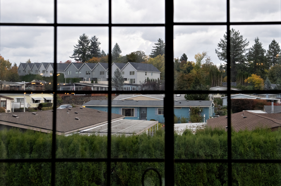 The tops of mobile homes are seen as Rep. Marie Gluesenkamp Perez, D-Skamania, meets with residents of the Vista Del Rio mobile home park in Vancouver on Wednesday afternoon. The manufactured homes are considered personal property making it difficult to receive home loans needed to buy back the park. (Amanda Cowan/The Columbian)