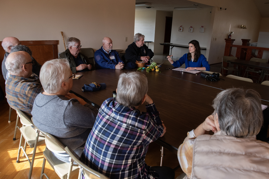 Rep. Marie Gluesenkamp Perez, top right, meets with residents of the Vista Del Rio mobile home park in Vancouver on Wednesday afternoon. The visit highlighted mobile homes as a good option to address shortfalls in the housing supply. (Amanda Cowan/The Columbian)