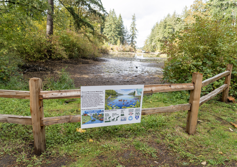 A sign informs passersby about nonpoint source pollutants affecting Lacamas Lake on Monday at Lacamas Lake in Camas. The signs were installed after a partnership between the city of Camas and the Camas High School Watershed Alliance Club. (Taylor Balkom/The Columbian)