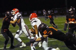 George Tkachenko (10) of Battle Ground goes in for the tackle on Thor Brody of Camas during the first half of the 4A Greater St. Helens League football game on Friday at Battle Ground District Stadium. (Jeff Klein/The Columbian)