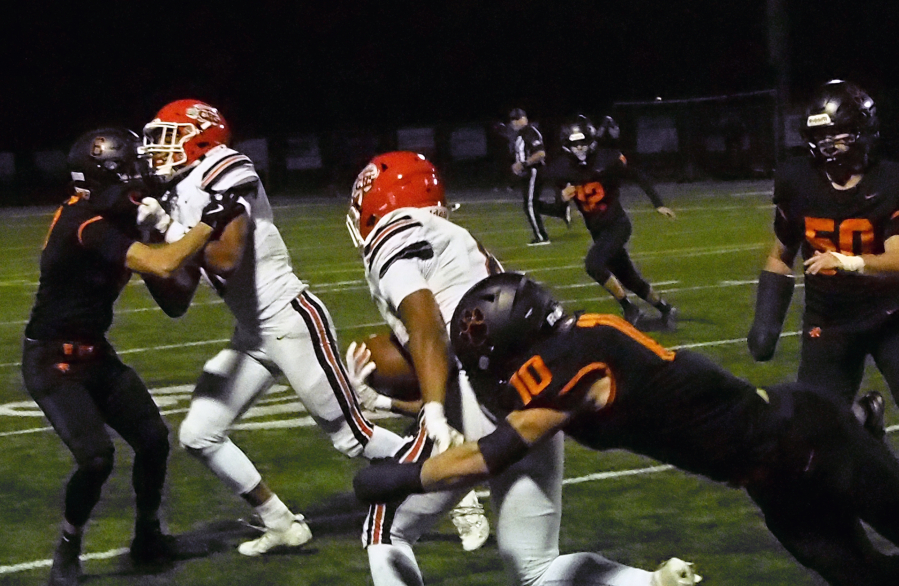 George Tkachenko (10) of Battle Ground goes in for the tackle on Thor Brody of Camas during the first half of the 4A Greater St. Helens League football game on Friday at Battle Ground District Stadium. (Jeff Klein/The Columbian)
