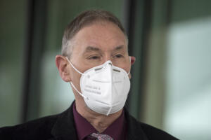 Clark County Public Health Public Health Director Dr. Alan Melnick, pictured here in 2021, urges people to get vaccinated ahead of the respiratory virus season and consider masks in crowded indoor spaces. (Amanda Cowan/The Columbian files)