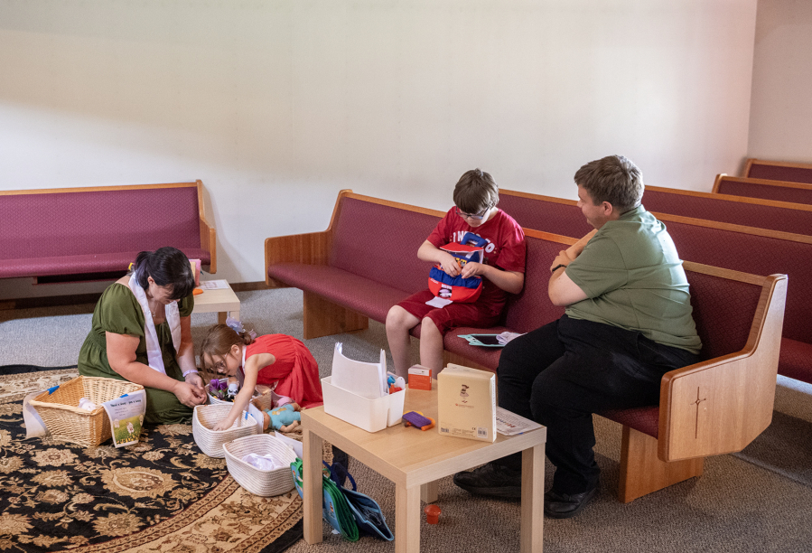 Robyn Kistemaker, from left, plays with daughter Noelle Hively, 5, while dad David Hively, right, watches son Lucas Hively, 11, play with a toy from the Pray-Ground area Sept. 8 at Messiah Lutheran Church. Both parents are pastors there.
&ldquo;Living with folks who are autistic has its own challenges, and so sometimes Noelle ends up feeling like the oddball out, or I end up feeling like the oddball out,&rdquo; David Hively said, &ldquo;because these two are over here geeking out about sharks or rocks or something. And they&rsquo;re just sharks, they&rsquo;re just rocks, why are we so invested in this?&rdquo; (Taylor Balkom/The Columbian)