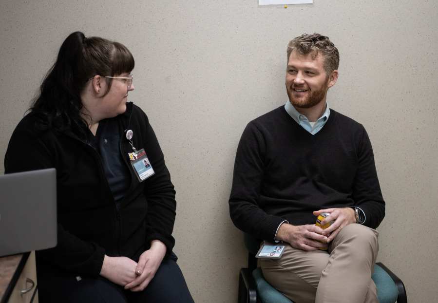 Pulmonologist Dr. Nicholas Wysham, right, and lung cancer screening program coordinator Shelby De La Cruz say it&rsquo;s important to return for annual screenings because cancer is often detected after several years. November is Lung Cancer Awareness Month. (Taylor Balkom/The Columbian)