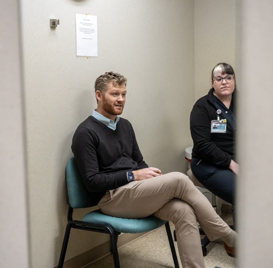 Pulmonologist Dr. Nicholas Wysham, left, and lung cancer screening program coordinator Shelby De La Cruz talk about lung cancer screenings Monday at Vancouver Clinic. November is Lung Cancer Awareness Month. (Taylor Balkom/The Columbian)