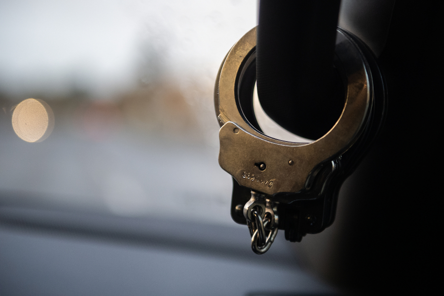 Handcuffs hang in a Clark County Sheriff&rsquo;s Office patrol car. This year, the agency hired 23 deputies, but 11 vacancies remain.