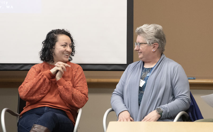 Veterans Janice Morales, left, and Donna Larson during a panel discussion that included veterans at Vancouver Housing Authority headquarters Monday.