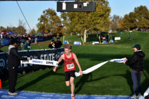 Cohen Butler of Camas crosses the finish line to win the 4A boys race at the state cross country championships on Saturday at Sun Willows Golf Course in Pasco. (Micah Rice/The Columbian)