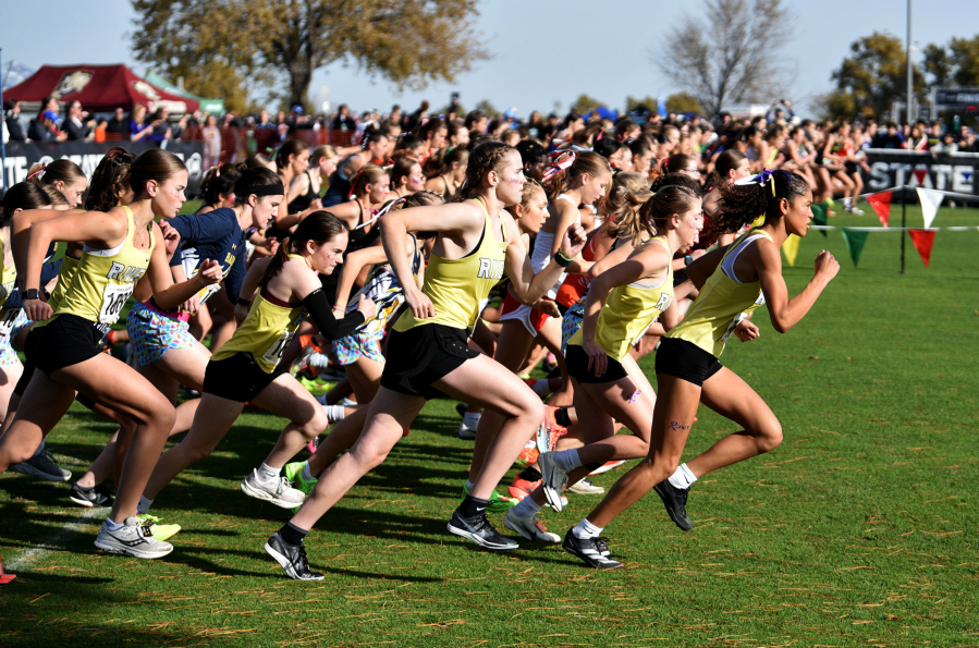 The Columbia River girls team races at the start of the 2A girls race at the state cross country championships on Saturday, Nov. 8, 2025 at Sun Willows Golf Course in Pasco. (Micah Rice/The Columbian)
