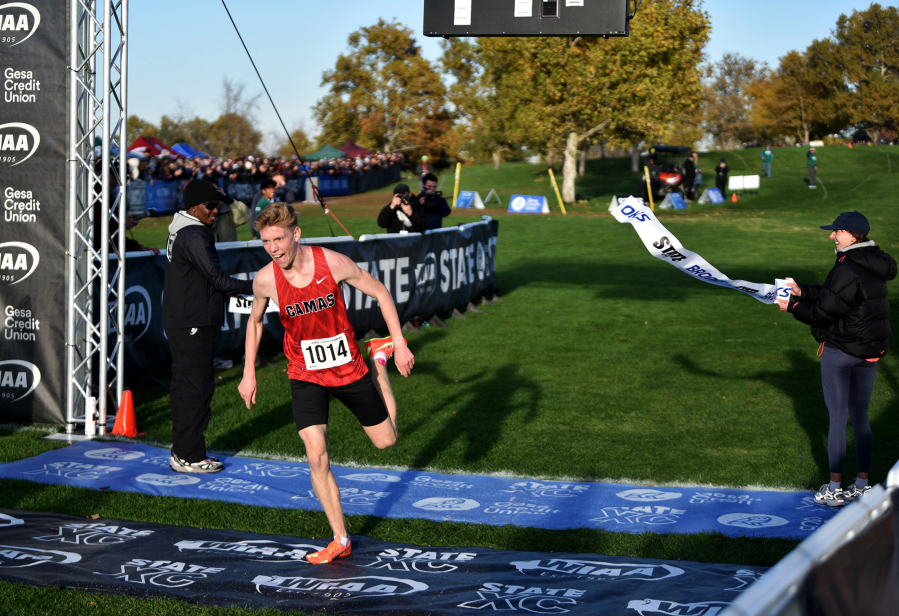 Cohen Butler of Camas crosses the finish line to win the 4A boys race at the state cross country championships on Saturday, Nov. 8, 2025 at Sun Willows Golf Course in Pasco. (Micah Rice/The Columbian)