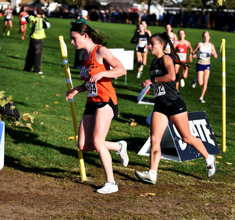 Sophia Rogers, left, of Battle Ground competes in the 4A girls race at the state cross country championships on Saturday, Nov. 8, 2025 at Sun Willows Golf Course in Pasco. (Micah Rice/The Columbian)