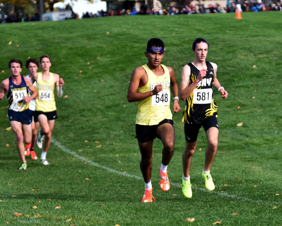 Aaron Barron Pintor (548) of Columbia River and Sylas Allen (581) of Hudson's Bay compete in the 2A boys race at the state cross country championships on Saturday, Nov. 8, 2025 at Sun Willows Golf Course in Pasco. (Micah Rice/The Columbian)