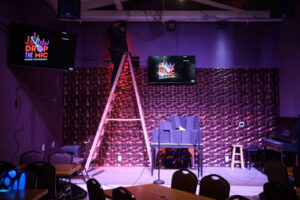 Sound and light tech and karaoke DJ C.J. Havener adjusts backsplash lights Nov. 13 at Drop The Mic in Camas. The business will be Clark County’s first family-friendly karaoke venue. (Photos by Taylor Balkom/The Columbian)
