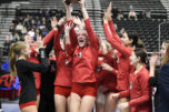 Camas senior Shaylee Stephen, center, holds the fifth-place trophy after a Class 4A state volleyball match against Puyallup on Saturday in Yakima. (Micah Rice/The Columbian)