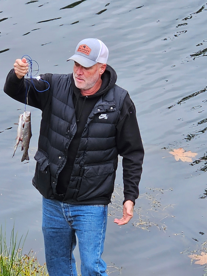 Blake Minster with a pair of trout caught recently in Icehouse Lake in the Columbia River Gorge. He eventually took home a limit by fishing Powerbait on the bottom. (Terry Otto for The Columbian)