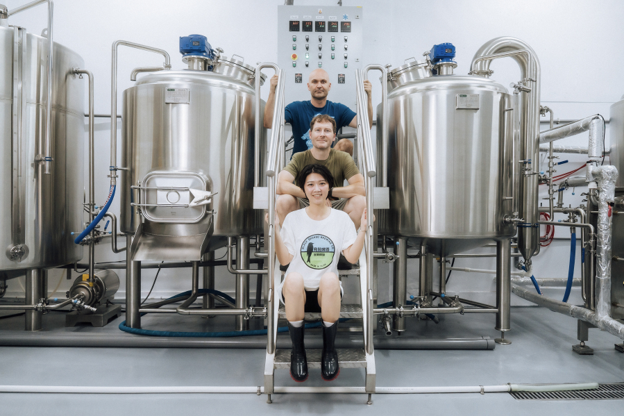 Black Drongo Brewery co-founders Devin Nail, top, Tim Smith, and Bella Wang pose for a photo at their Yilan City, Taiwan, brewery. (Contributed by Black Drongo Brewery)