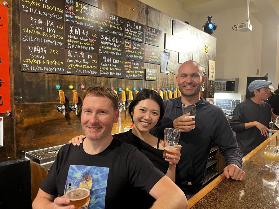 Black Drongo Brewery co-founders Devin Nail, right, Tim Smith, left, and Bella Wang pose for a photo at their Yilan City, Taiwan, brewery. (Photos contributed by Black Drongo Brewery)