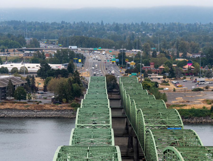 Cars travel along the Oregon side of Interstate 5 and the Interstate 5 Bridge on Oct. 5, 2022, as seen from the top of one of the northbound bridge lift towers. (Taylor Balkom/The Columbian files)