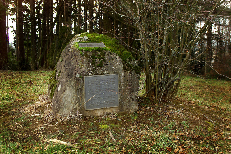 This boulder, with inset memorial plaques, marks the nearly forgotten Poor Farm cemetery adjacent to today&rsquo;s Heritage Farm and Hazel Dell Community Park. (The Columbian files)