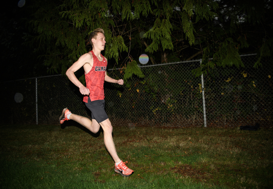 Camas cross country runner Cohen Butler runs near a treeline Thursday, Nov. 13, 2025, at Camas High School. Butler is The Columbian&Ccedil;&fnof;&Ugrave;s All-Region boys cross country runner of the year. (Taylor Balkom/The Columbian)