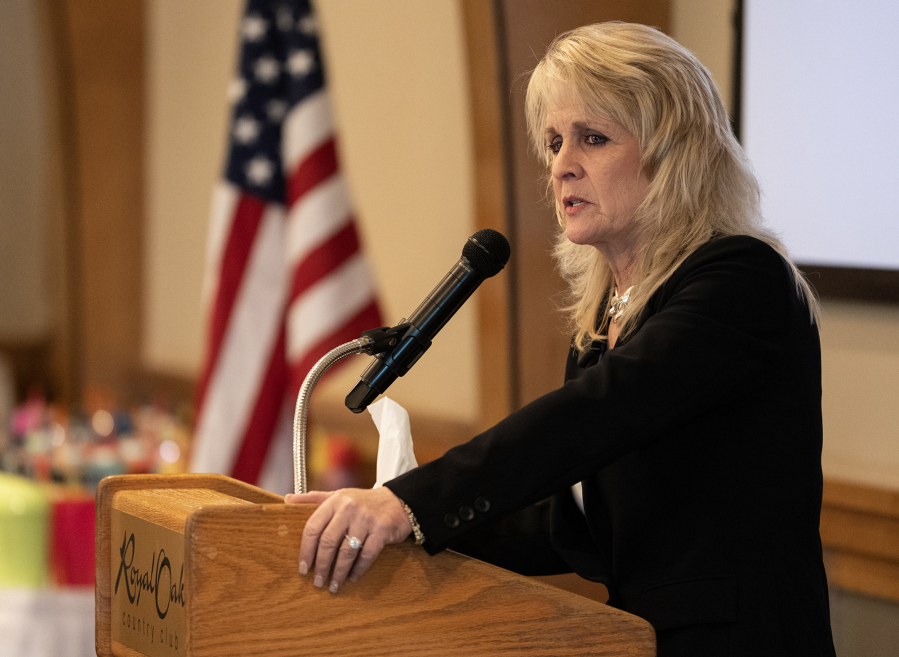 Northwest Battle Buddies founder and CEO Shannon Walker talks to a crowd Friday during a Northwest Battle Buddies graduation ceremony at Royal Oaks Country Club in Vancouver.