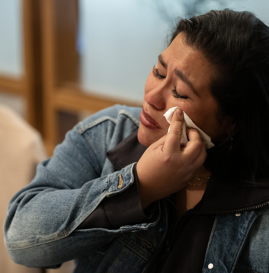 Veteran Rachel Lopez wipes a tear from her eye Friday during a Northwest Battle Buddies graduation ceremony at Royal Oaks Country Club in Vancouver.