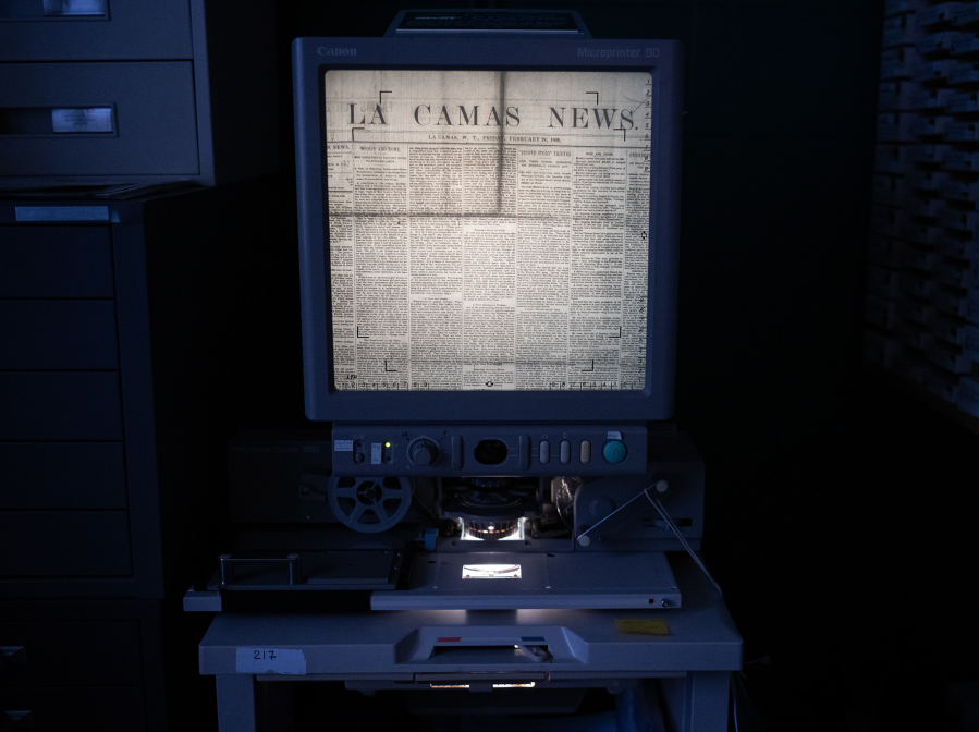 A microfilm projector displays the front page of the Friday, Feb. 24, 1888, edition of Lacamas News on Friday at the Clark County Genealogical Society. The Camas Public Library recently donated its historical newspaper microfilm collection to the organization. (Taylor Balkom/The Columbian)