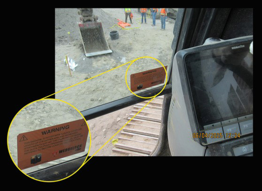 An orange warning sticker, shown here in an L&I photo taken inside the excavator involved in the incident, prompts the excavator operator to consult the quick coupler operation manual before use. (Contributed by the Washington State Department of Labor & Industries)