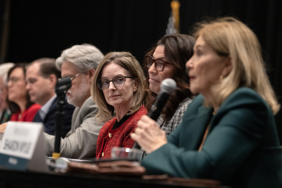 Sen. Annette Cleveland, D-Vancouver, center, joins Rep. Monica Stonier, D-Vancouver, as they listen to Rep. Sharon Wylie, D-Vancouver, speak during the Greater Vancouver Chamber&rsquo;s Legislative Outlook event at the Hilton Vancouver Washington on Tuesday morning. On the cusp of a drop in revenue over the coming years, lawmakers expect a tough upcoming legislative session. (Amanda Cowan/The Columbian)