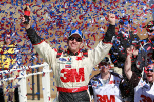 Greg Biffle celebrates in victory lane after winning the NASCAR Sprint Cup Series race on Oct. 3, 2010, at Kansas Speedway. It was one of 19 career wins. (Associated Press file)