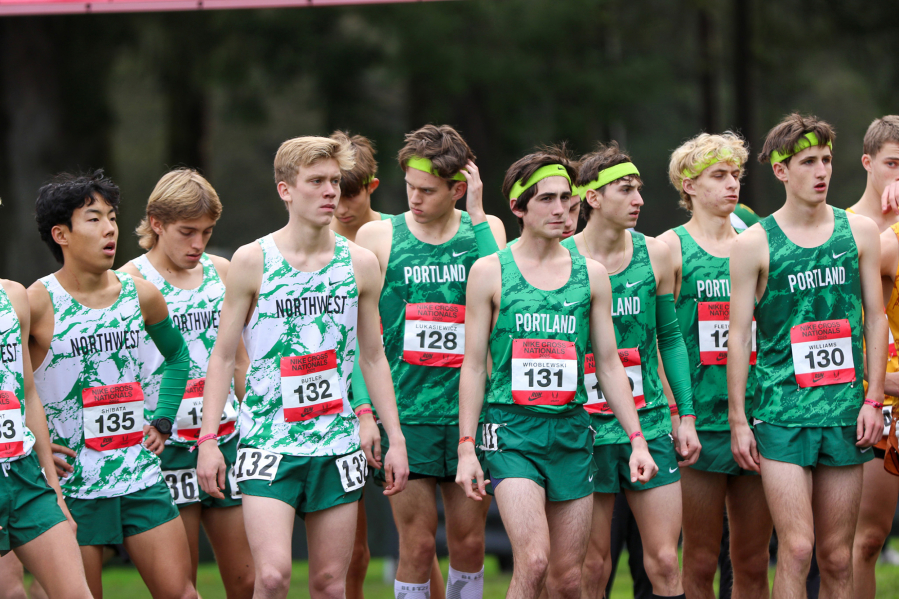 Cohen Butler of Camas (132) stands alongside other Northwest individual competitors prior to the start of the Nike Cross Nationals 5,000-meter men&rsquo;s championship race on Saturday, Dec. 6, 2025, at Glendoveer Golf Course in Portland. (Ken Martinez/West Coast XC)