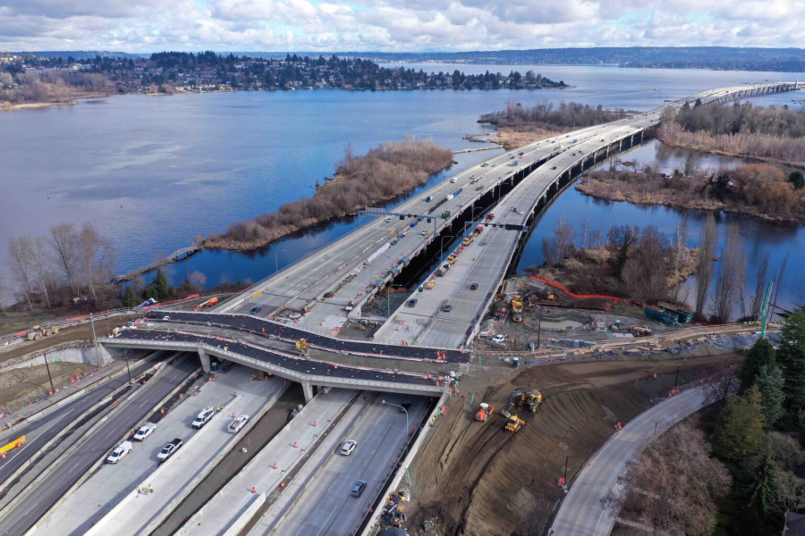 An aerial view in February 2024 of work on a new bike and pedestrian bridge over state Route 520 and connecting trails north and south of the highway. (Washington State Department of Transportation)