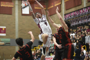Malachi Patton of Prairie drives the lane against Camas in the teams&rsquo; game Thursday at Prairie High School (Meg Wochnick/The Columbian)