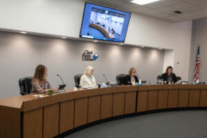 Sherry Erickson, from left, Jane Van Dyke and Nancy Barnes take part in the Clark Public Utilities board of commissioners meeting with CEO Lena Wittler in Vancouver on Oct. 21. On Tuesday morning, the utility’s board of commissioners unanimously approved separate budgets of $500 million for the electric system, $95 million for the generating system and $41 million for the water system. (Amanda Cowan/The Columbian files)