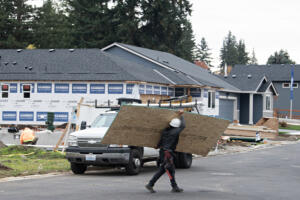 The local construction industry has suffered through a workforce shortage for years. Some fear that an uptick in immigration enforcement could exacerbate the issue. (Amanda Cowan/The Columbian files)