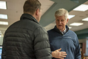Washougal school board member Jim Cooper, right, talks to Washougal resident Todd Kestner on March 28, 2023, during a &ldquo;listening tour&rdquo; session at Washougal High School. (Taylor Balkom/The Columbian)