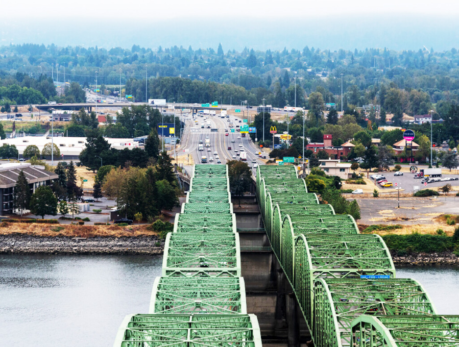 Cars travel along the Oregon side of Interstate 5 and the Interstate 5 Bridge on Oct. 5, 2022, as seen from the top of one of the northbound bridge lift towers. (Taylor Balkom/The Columbian files)
