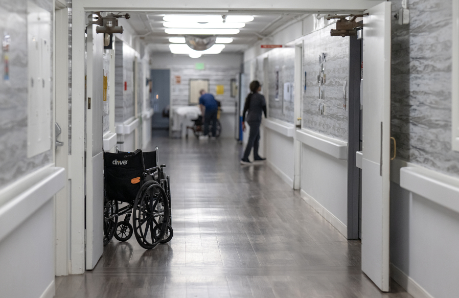 Empty wheelchairs sit in the hallway at Vancouver Specialty and Rehabilitation Care in Vancouver on Dec. 4. (Photos by Amanda Cowan/The Columbian)