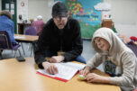 Reading mentor Lee Campen, left, works with third-grader Kellin Bartholomew, 8, during the Read Northwest program at Hathaway Elementary School on Dec. 8. Read Northwest is a nonprofit that helps children learn to read at their grade level with one-on-one support from a mentor. (Photos by Amanda Cowan/The Columbian)