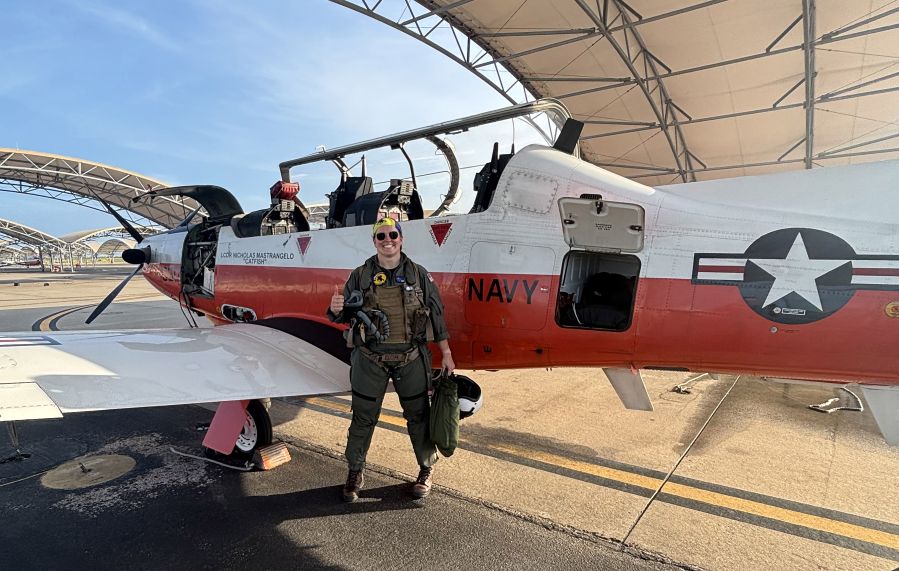 Washougal native Keira Mathews stands in front of a T-6 plane. (Contributed by Alan Stogin)