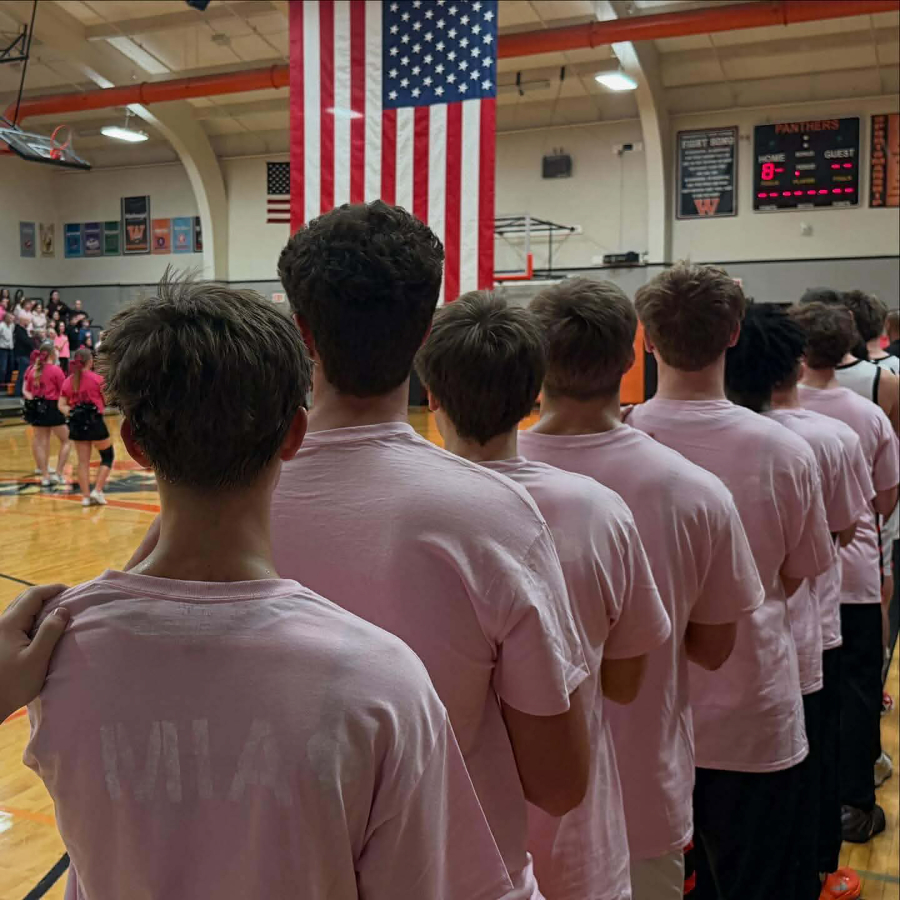 Washougal High School boys basketball players wear pink &ldquo;Love Mia&rdquo; T-shirts before their home game on Jan. 20. (Scott Lockard)