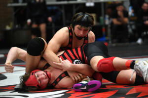 Camas&rsquo; Simon Jarrell (top) takes control of his brother, Arthur Jarrell, during their 175-pound district final match Saturday at Prairie High School. Simon Jarrell won 30-27. (Meg Wochnick/The Columbian)