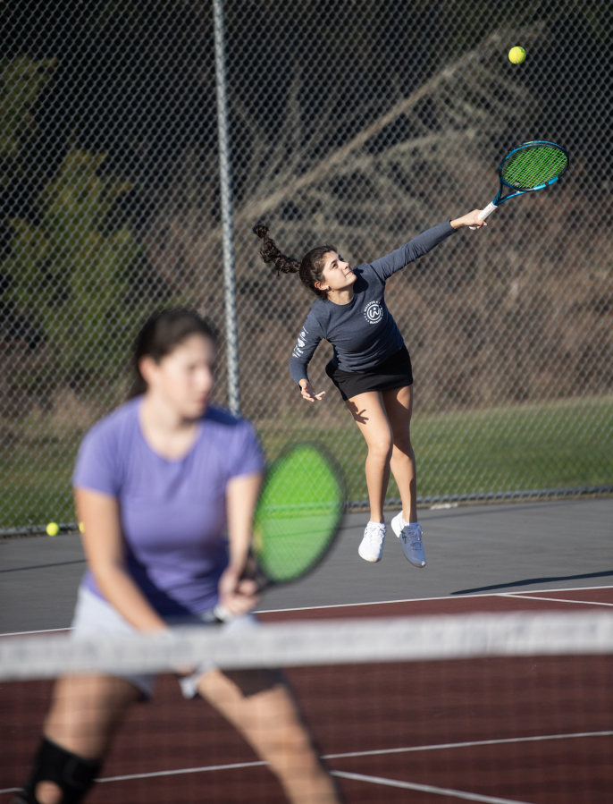 The Camas girls tennis team practices on March 7 at Camas High School. (Taylor Balkom/The Columbian files)