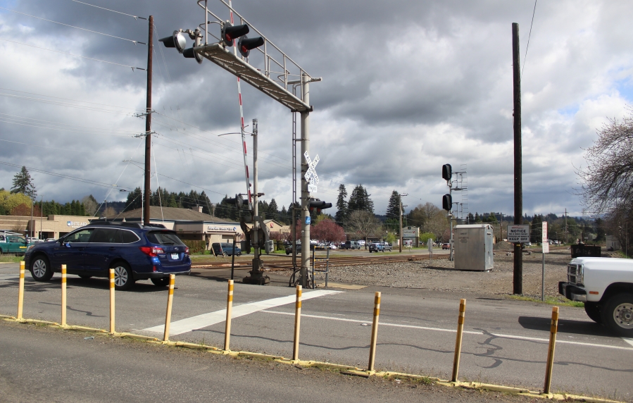 Traffic proceeds north on 32nd Street across a set of railroad tracks in Washougal on March 31, 2022. The city will receive a $2 million allocation for its 32nd Street Rail Crossing project. (Doug Flanagan/The Columbian files)