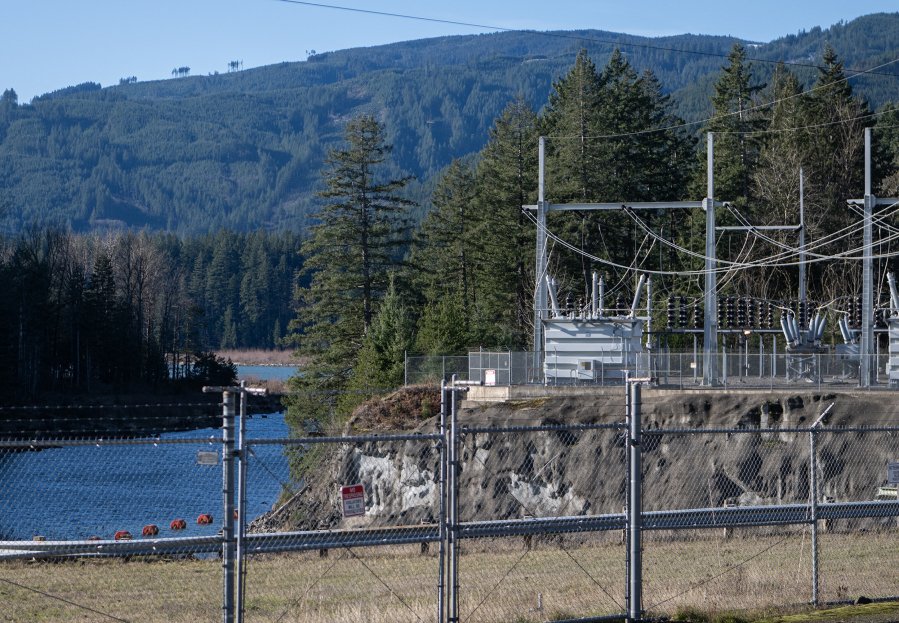 A substation sits behind the Swift No. 2 hydroelectric station and next to Lewis River on Jan. 16 in Cougar. As more energy is added to the region&rsquo;s electric grid, the system has to undergo upgrades to handle the new capacity. (Taylor Balkom/The Columbian)
