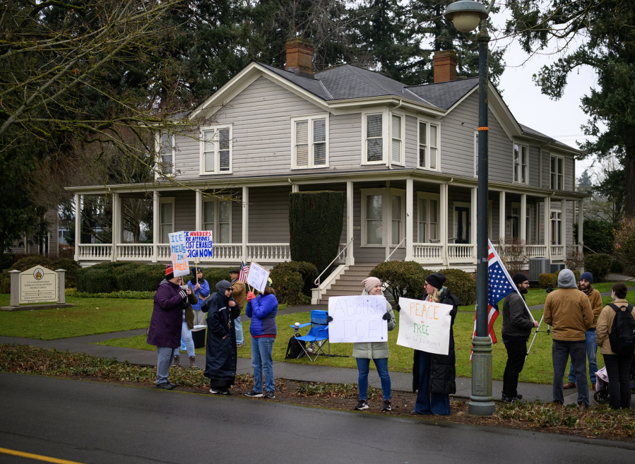 A crowd gathers Wednesday outside the offices of Rep. Marie Gluesenkamp Perez, D-Skamania, on Officers Row in Vancouver. (Photos by Taylor Balkom/The Columbian)
