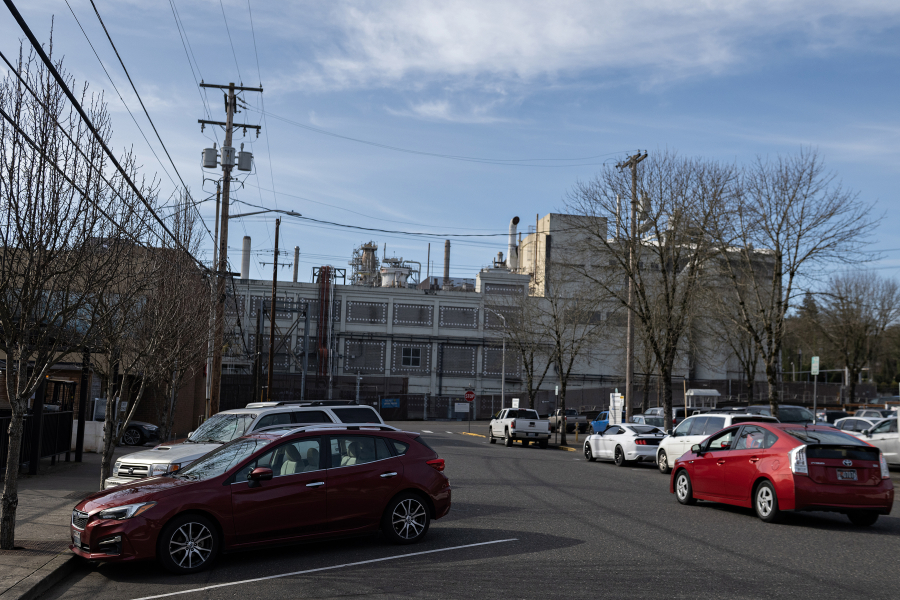A driver passes both diagonal and parallel parking spots along Northeast 5th Avenue in Camas on Feb. 6. The city of Camas is proposing the addition of 55 downtown parking spaces due to the upcoming construction of a new fire station. (Amanda Cowan/The Columbian)