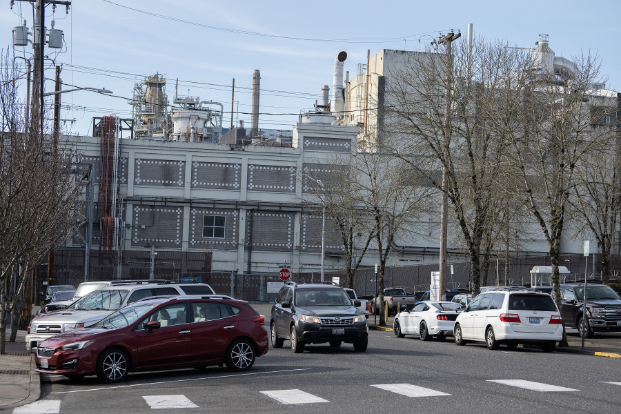 A driver passes both diagonal and parallel parking spots along Northeast 5th Avenue in Camas on Feb. 6. The city of Camas is proposing the addition of 55 downtown parking spaces to compensate for the 50 that will be removed due to the upcoming construction of a new fire station. (Amanda Cowan/The Columbian)