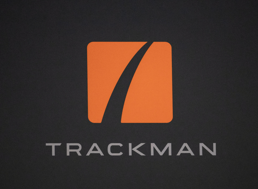 The Trackman logo sits on the side of one of its golf simulation machines Tuesday at Camas Indoor Golf Club in Camas. (Taylor Balkom/The Columbian)