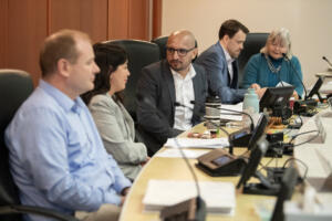 Clark County Council members Glen Yung, from left, Michelle Belkot, Wil Fuentes, Matt Little and Sue Marshall chat during a break during a 2025 meeting. The council agreed Wednesday to move forward with a resolution in support of community unity, condemning political violence and protecting constitutional rights. (Amanda Cowan/The Columbian files)